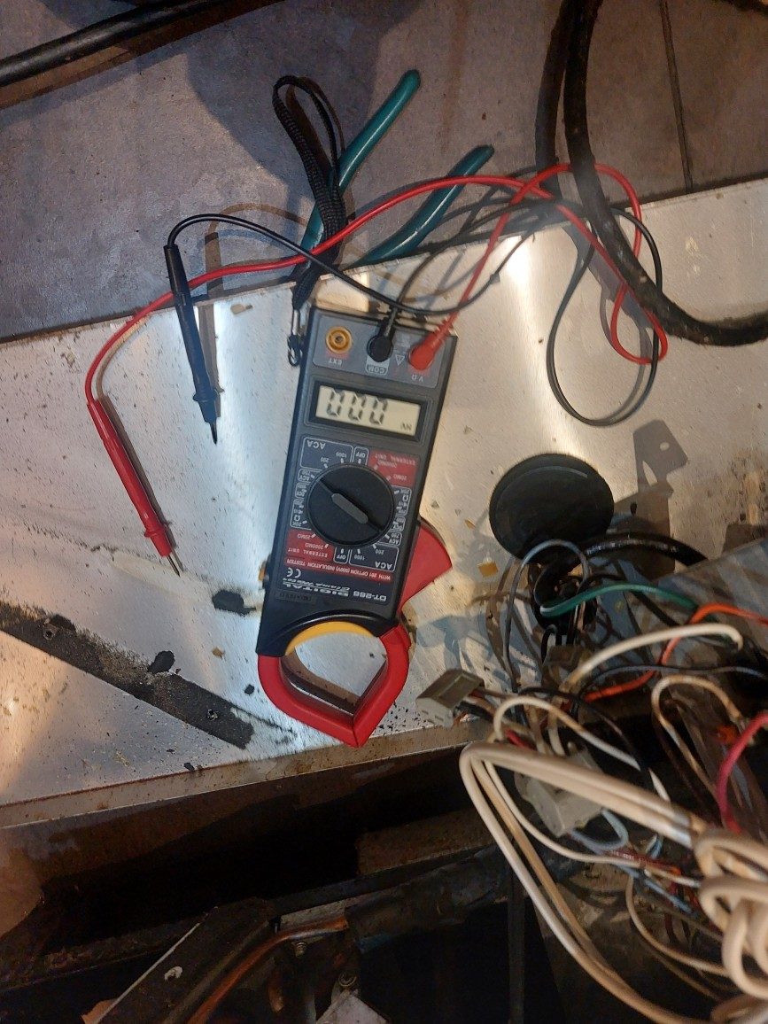 Clamp multimeter and tools during electrical diagnostics